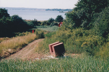 Brick house sculture with view on Flensburg Fjord