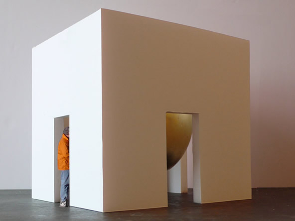 Cubic room with golden sphere